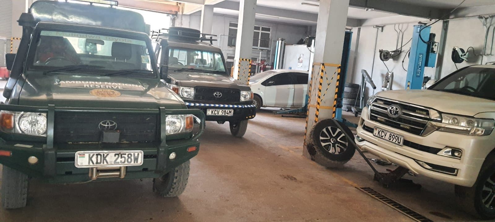 Fleet 4x4 vehicles parked inside the workshop bay