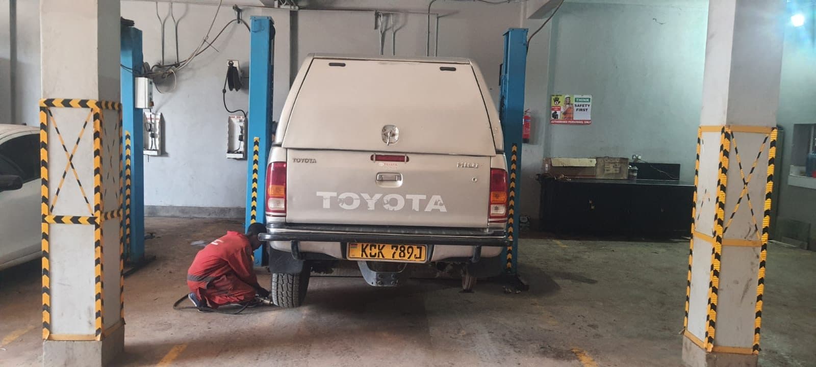 Toyota Hilux raised on a lift for general service
