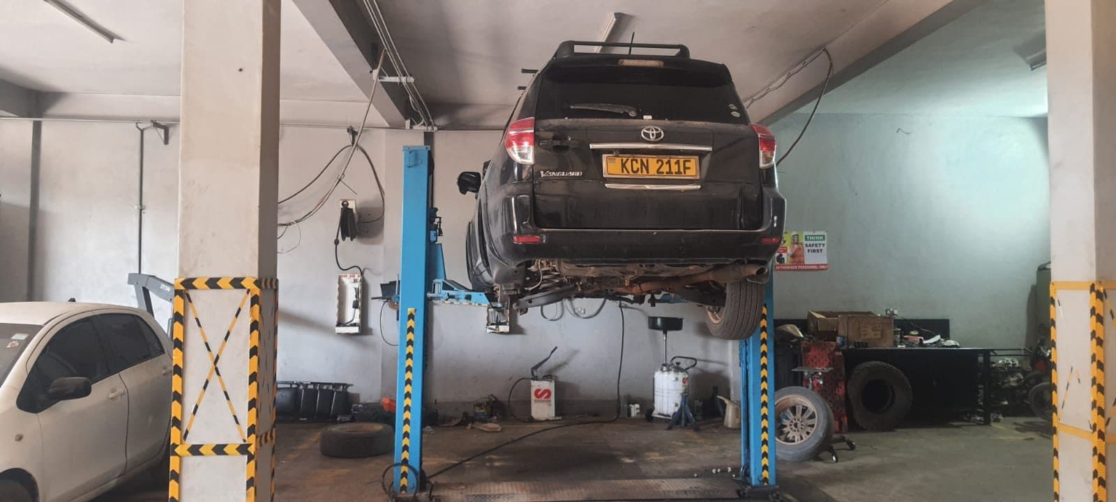 Toyota Vanguard raised on a lift for undercarriage inspection