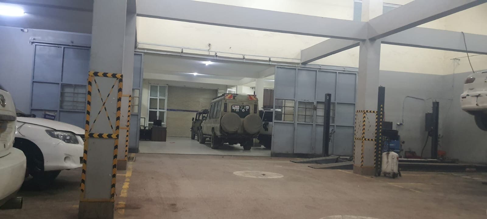 Vehicles parked securely overnight inside Parkside Garage's gated workshop compound
